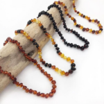COLLIER AMBRE DE DENTITION