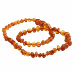 COLLIER AMBRE DE DENTITION
